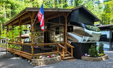 Fifth Wheel RV Setup With a Large Wooden Deck