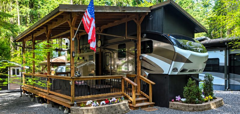 Fifth Wheel RV Setup With a Large Wooden Deck