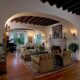 Beautiful Hacienda Living Rooms With Arches, Beams, and Cozy Fireplaces