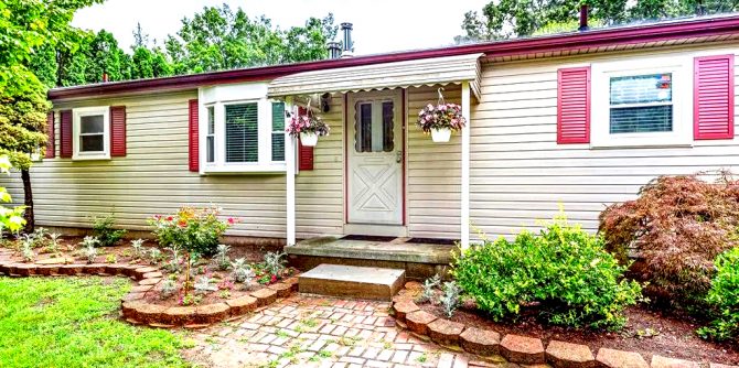 Discover 15 creative landscaping ideas for single wide mobile homes. From charming garden beds to cozy outdoor seating areas, these ideas will help you make the most of your outdoor space and add curb appeal to your home.