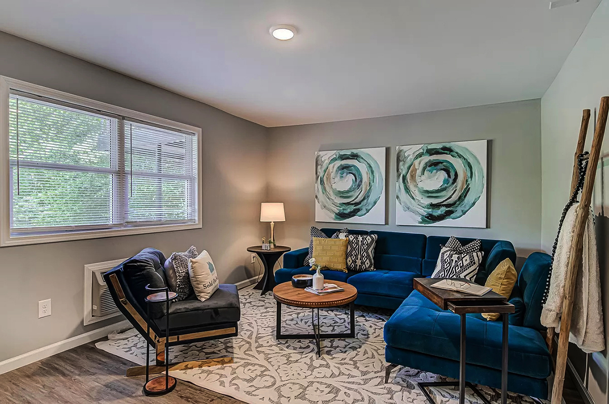 The Navy Blue Sofa With Neutral Walls